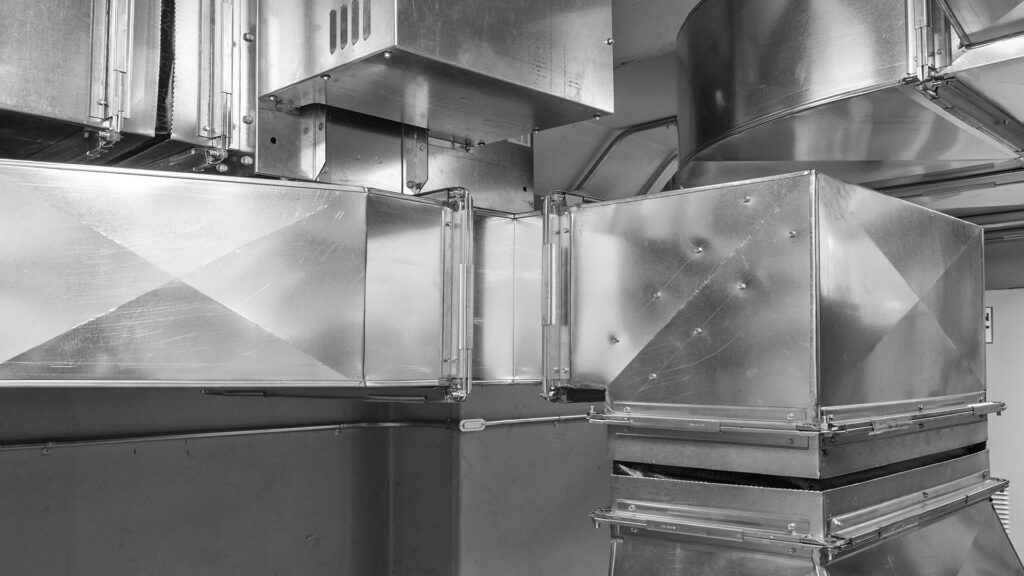 Interior view of extensive metal ductwork, showcasing HVAC installation by Mid-City HVAC, INC. in Chicago, IL.