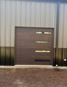 Interior view of a modern white garage door with an opener, springs, and tracks installed by Okie Garage Door Specialist in Tulsa, OK