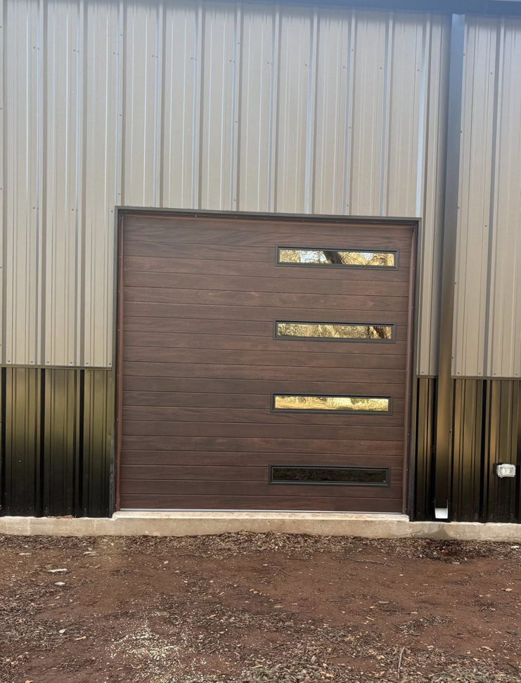 Interior view of a modern white garage door with an opener, springs, and tracks installed by Okie Garage Door Specialist in Tulsa, OK