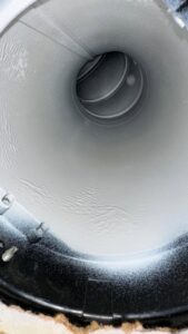 Interior view of a clean, round air duct serviced by Delta Clean Air in Boston, MA