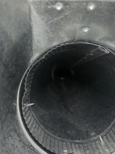 An interior view of a clean round HVAC duct, showcasing quality work by Air Duct Solutions in Waukee, IA.