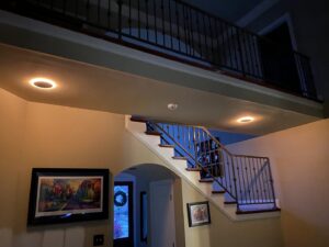 An interior staircase with modern recessed lighting installed by Joule Electrical A/C & Heating Services in New Orleans, LA.
