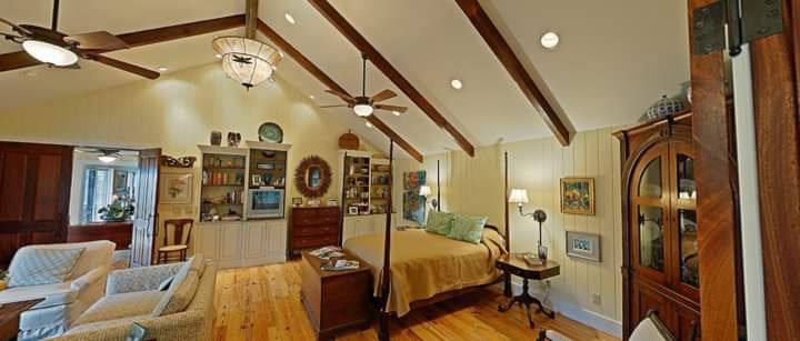 A spacious interior room showcasing multiple ceiling fans and various light fixtures, installed by Greif Electric Company in Dolgeville, NY.