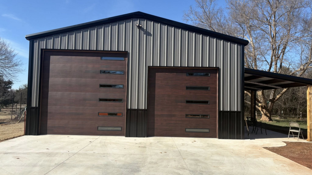 Interior view of a traditional white panel garage door with an opener and tracks installed by Okie Garage Door Specialist in Tulsa, OK