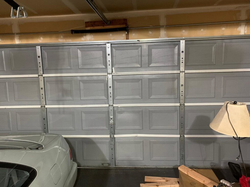An interior view of a garage door, showcasing the panels and bracing, serviced by BSD Garage Door Service in Naperville, IL.