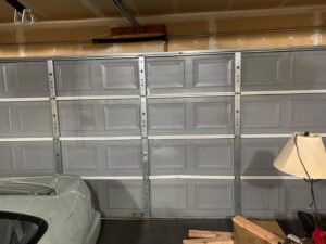 An interior view of a garage door, showcasing the panels and bracing, serviced by BSD Garage Door Service in Naperville, IL.