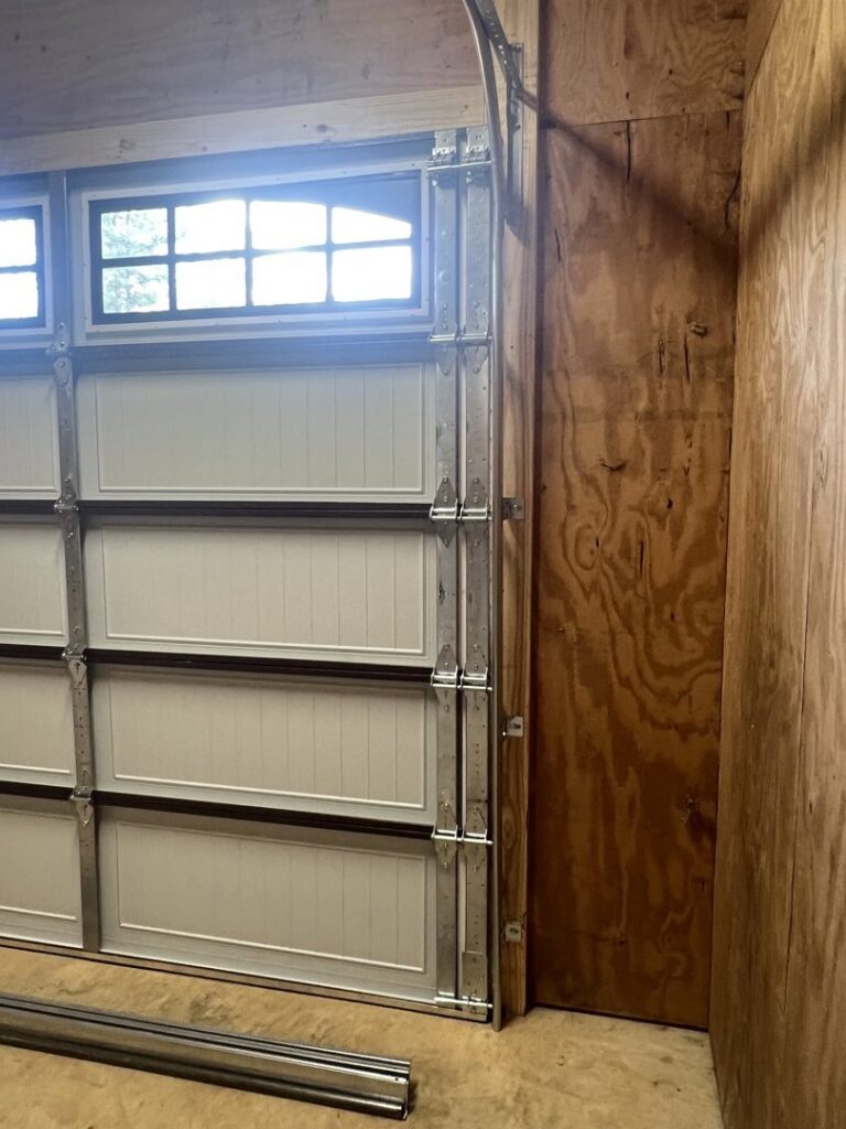 Interior view of a newly installed garage door showing panels and tracks by Specialty Garage Door in Bossier City, LA