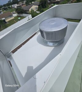 An interior view of a white chimney cap showing the fan installed by SWFL Chimney Caps Inc. in Fort Myers, FL.