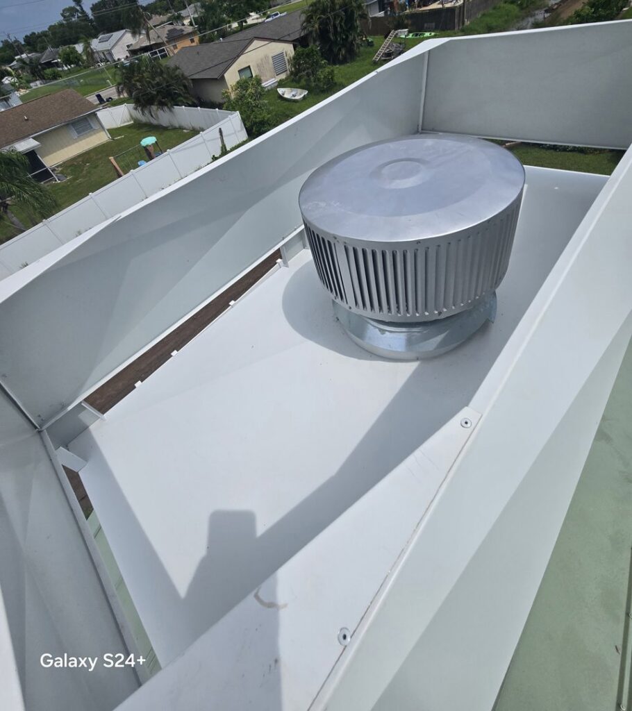An interior view of a white chimney cap showing the fan installed by SWFL Chimney Caps Inc. in Fort Myers, FL.