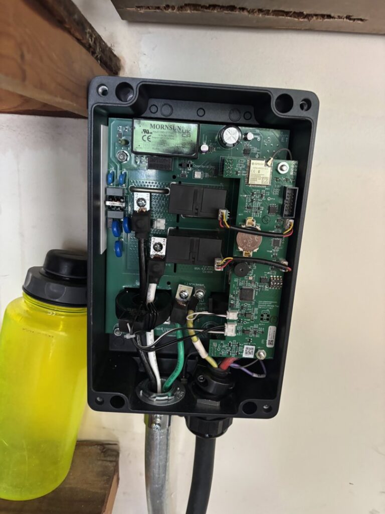 Detailed view of internal electrical wiring and circuit board components being worked on by Amped Electric in Virginia Beach, VA.
