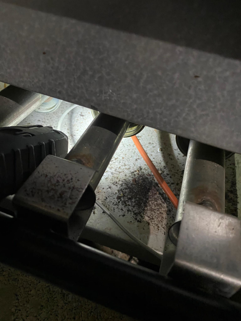 Close-up of internal furnace components during an inspection by Wilson Heating & Cooling, Inc. in North Chicago, IL.