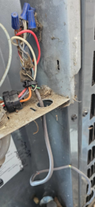 Detailed internal wiring and components of an HVAC unit, maintained by Anubis Mechanical in Goose Creek, SC.