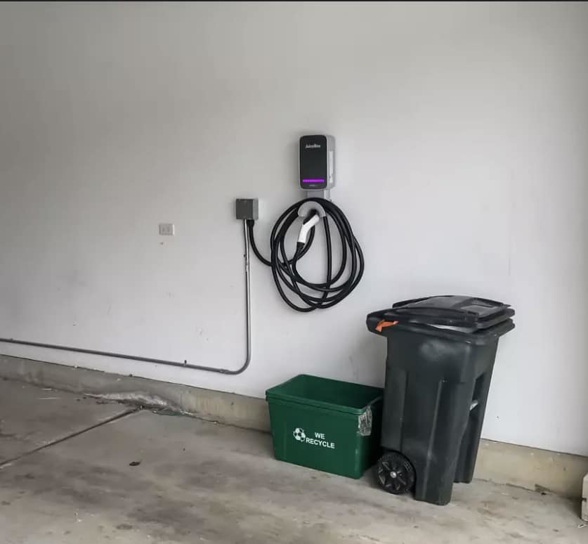 A JuiceBox electric vehicle charger installed on a garage wall by EVC Pro Solutions in Marietta, GA.