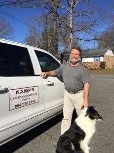 The owner of Kamps Carpet Cleaning Inc. standing proudly next to his service truck in Richmond, VA.