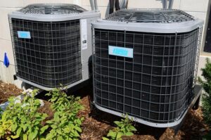 Two KeepRite outdoor HVAC condenser units installed by Federal Heating & Cooling in Dresden, OH.