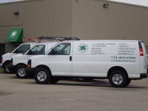 Kelley Brothers LC service vans parked outside their business, ready for HVAC and generator jobs in Livonia, MI.