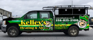 A brightly branded Kelley's Heating & Air service truck with a leprechaun mascot in Dadeville, AL