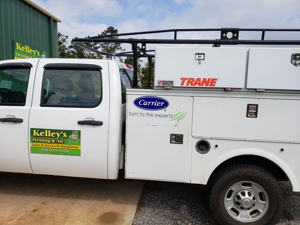 A Kelley's Heating & Air service truck with Carrier and Trane branding in Dadeville, AL