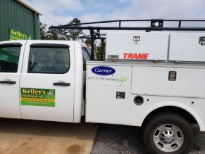 A Kelley's Heating & Air service truck with Carrier and Trane branding in Dadeville, AL