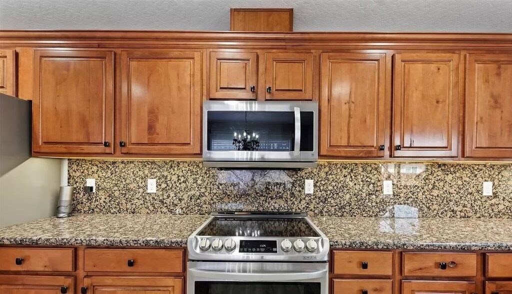 Kitchen with installed microwave, stove, and electrical outlets by Lindsey and Son Electric, LLC in Summerville, SC