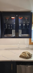 Kitchen cabinet with internal lighting and countertop outlets installed by Steven Polom, Journeyman Electrician in Springfield, MA.