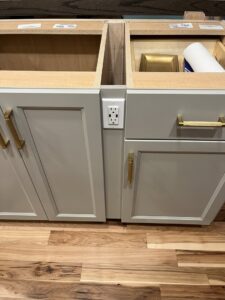 A new electrical outlet installed flush with kitchen cabinetry by Josh LaFerriere Electric in Westbrook, ME.