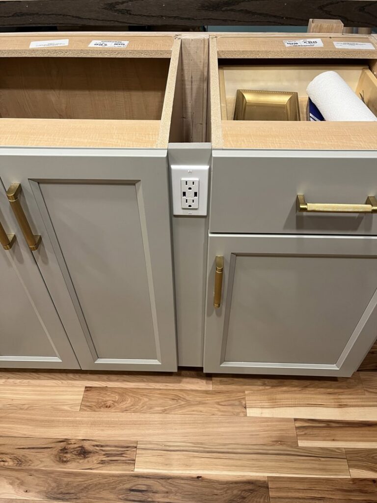 A new electrical outlet installed flush with kitchen cabinetry by Josh LaFerriere Electric in Westbrook, ME.