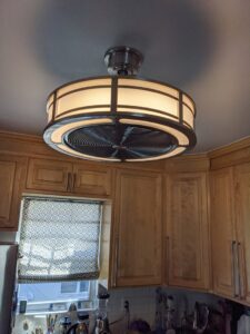 A modern ceiling fan and light fixture installed in a kitchen by York Electric of Westchester in Yonkers, NY.