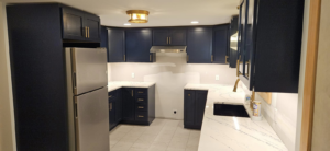 Full kitchen view showcasing new ceiling light and appliance outlets installed by Steven Polom, Journeyman Electrician in Springfield, MA.