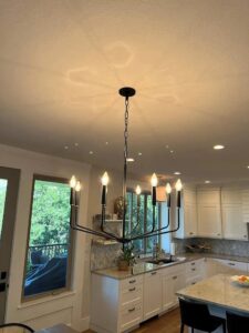 A modern chandelier installed in a kitchen by All Aboard Services in Farr West, UT.