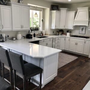 Newly installed dark hardwood flooring in a modern kitchen by Carpets By Cal Inc in Vernal, UT