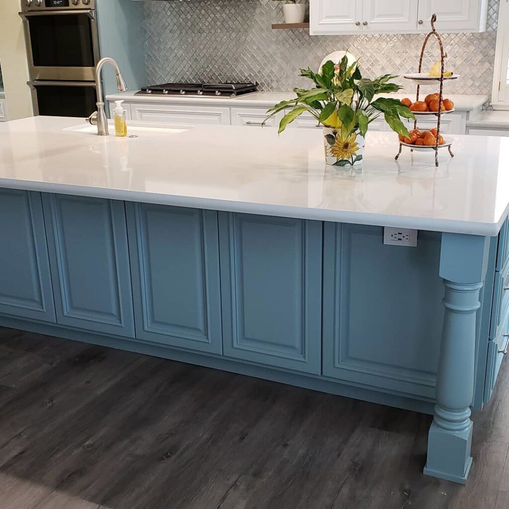 Modern kitchen island with dark laminate flooring installed by Sulcas Carpets & more in Elk Grove, CA