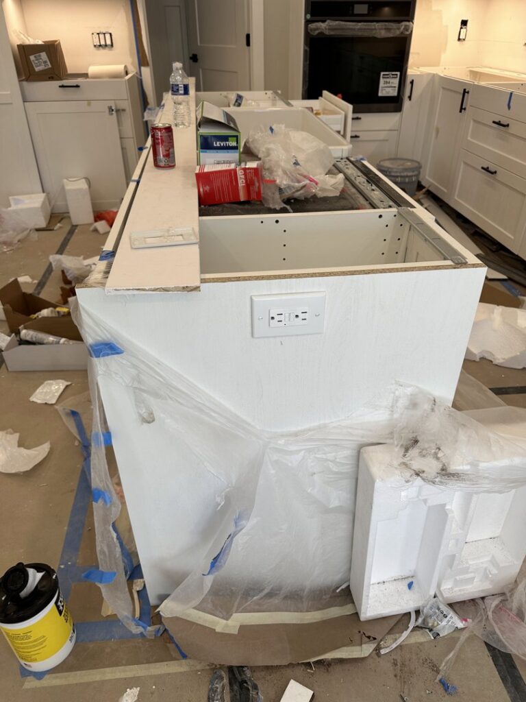 Electrical outlet installed on a kitchen island during construction by Electric R US LLC in Dearborn, MI.