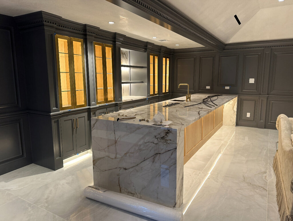 Kitchen island with visible wiring and installed lighting, showcasing electrical work by Trizone Electric, LLC in Houston, TX.