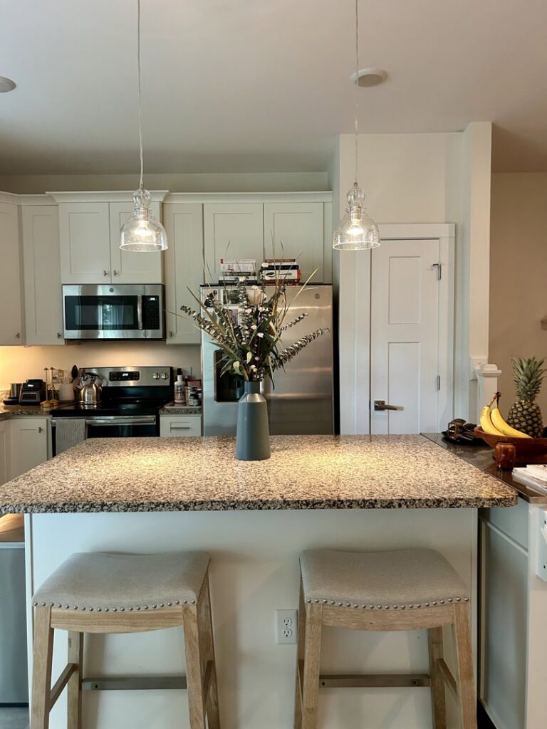 Kitchen island with new pendant lighting and electrical outlets by Lindsey and Son Electric, LLC in Summerville, SC