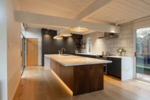 Kitchen with island pendant lights, recessed lighting, and under-cabinet lighting installed by R.C Electric, Inc. in San Francisco, CA