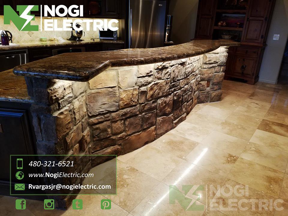Kitchen island with custom under-counter lighting installed by Nogi Electric LLC in Mesa, AZ.