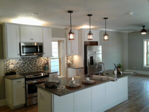 Modern kitchen with new pendant lights, under-cabinet lighting, and appliance wiring by In the Light Electrical LLC in Kansas City, KS
