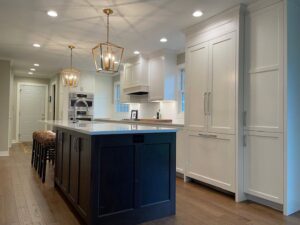 Kitchen lighting design and installation featuring pendant and recessed lights by Kavanagh Electric in Fresno, CA.