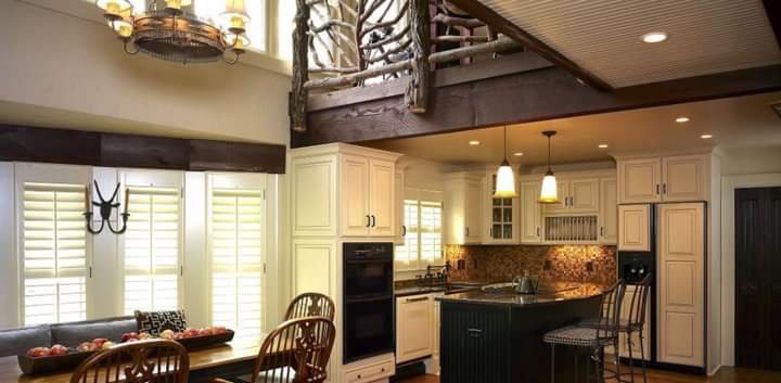 A kitchen interior featuring modern pendant lights and recessed lighting fixtures, installed by Greif Electric Company in Dolgeville, NY.