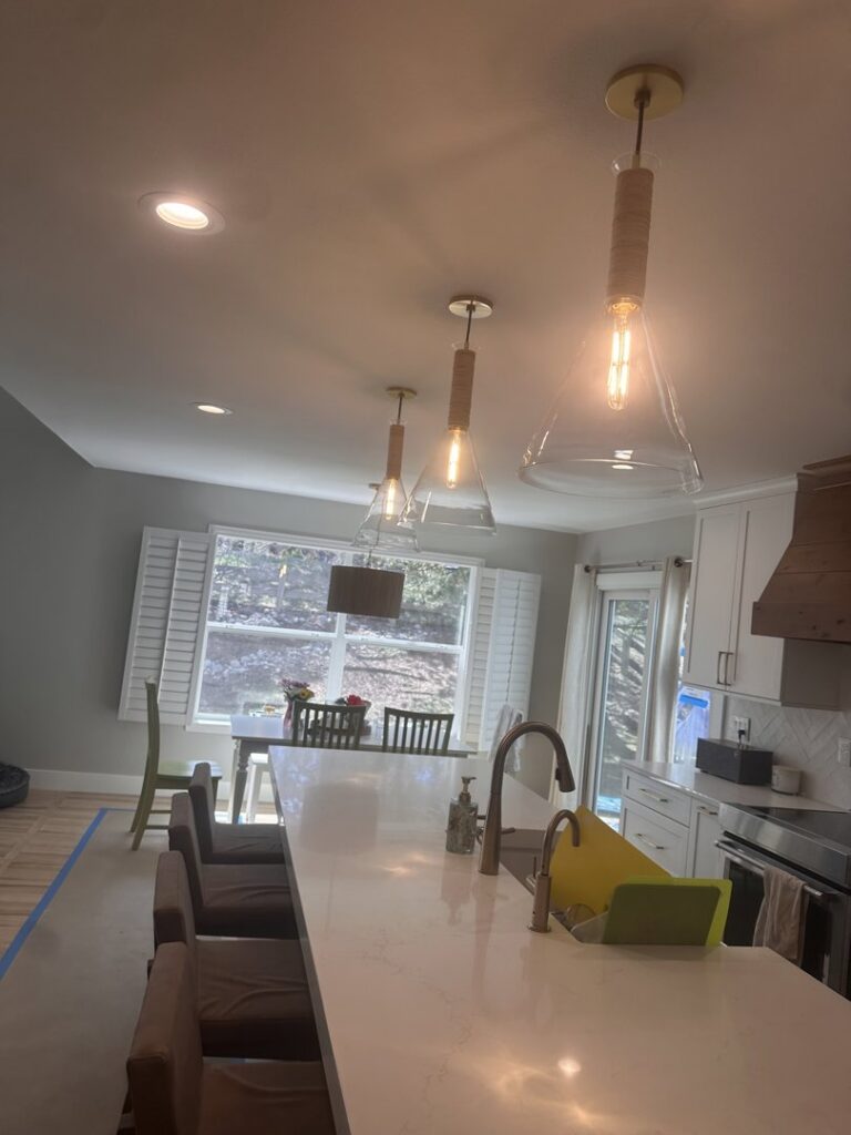 Modern kitchen with new pendant and recessed lighting installed by All Electric llc in Denver, CO