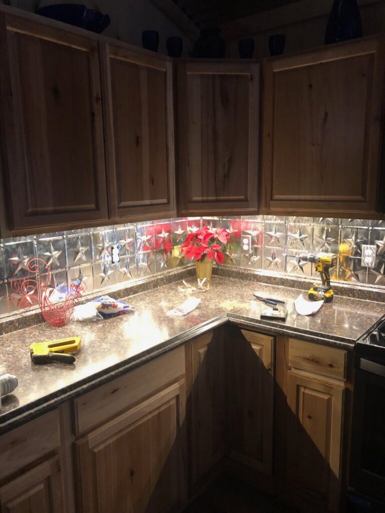 Kitchen with new under-cabinet lighting and tools on the counter from Bacon Electric, LLC in Concord, NH.
