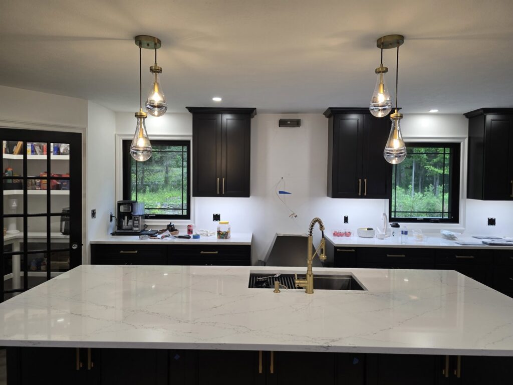 New kitchen lighting installation, including pendant and under-cabinet lights, by Be Bright Electric in Erie, PA.