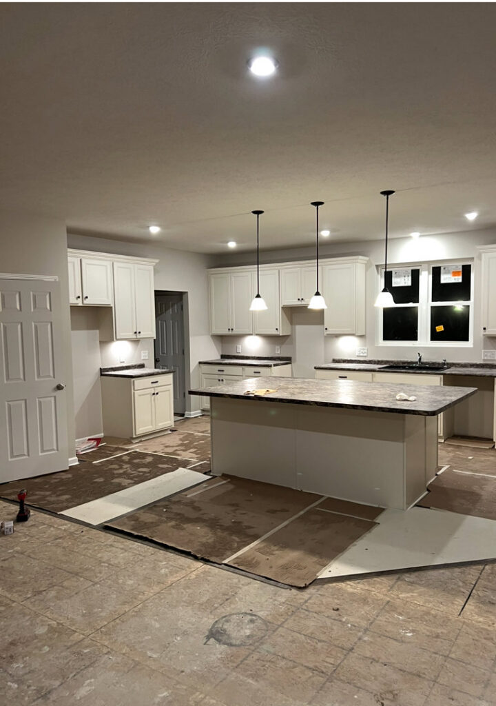 Kitchen lighting installation, including recessed and pendant lights, during a construction project by Kouris Electric LLC in Canton, OH.
