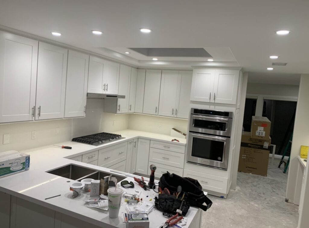 Kitchen under construction with recessed and under-cabinet lighting being installed by Gilmore Electrical in Saint Louis, MO