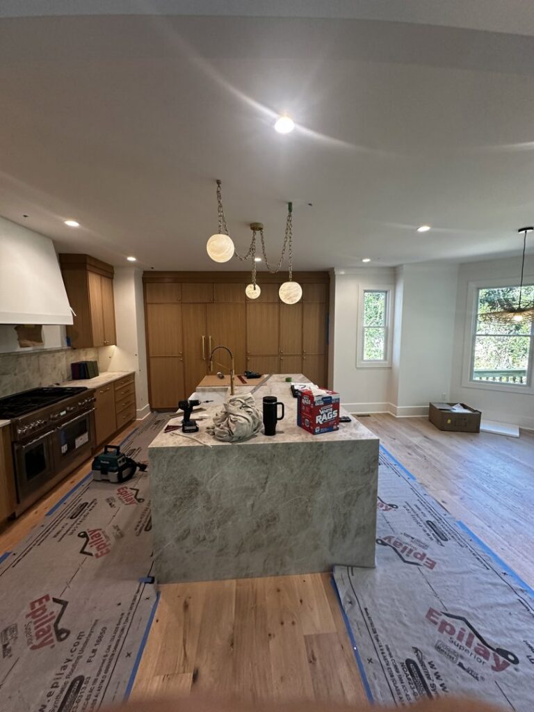 Kitchen under construction with pendant and recessed lighting installed by Ampler Electrical Services in Wilmington, NC.