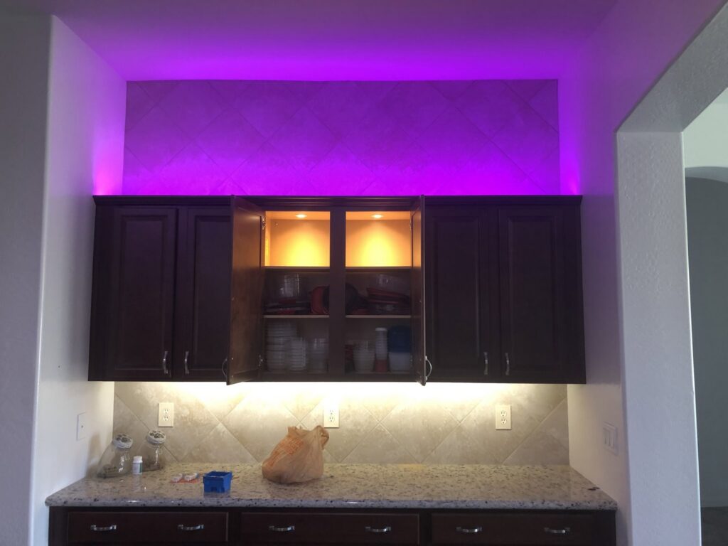 Modern kitchen with newly installed under-cabinet and accent lighting by TAP and Sons Electric in Tempe, AZ.