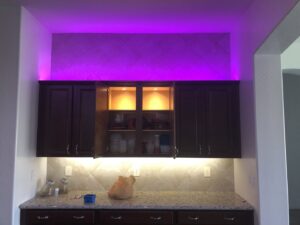 Modern kitchen with newly installed under-cabinet and accent lighting by TAP and Sons Electric in Tempe, AZ.