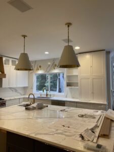 New kitchen pendant lights and wall sconces installed during construction by Watts Up Electric in Crystal Lake, IL.