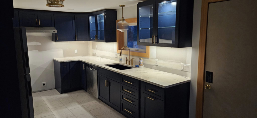 Newly installed under-cabinet and ceiling lighting in a modern kitchen by Steven Polom, Journeyman Electrician in Springfield, MA.
